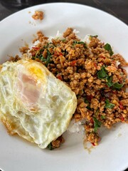 Rice topped with stir-fried pork and basil, Rice topped with stir fried minced pork and basil with Fried egg