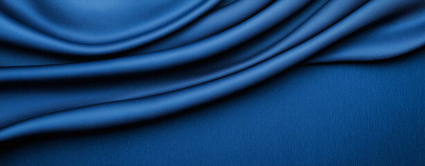 Obraz premium A rich deep blue textured background with a weathered effect. The image features varying shades of navy and electric blue ,dimension, silk,satin, fabric . 