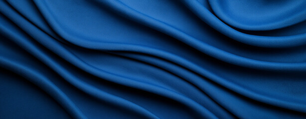 Obraz premium A rich deep blue textured background with a weathered effect. The image features varying shades of navy and electric blue ,dimension, silk,satin, fabric . 