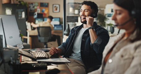 Happy man, agent or tech support with headphones at call center for web navigation or technical...