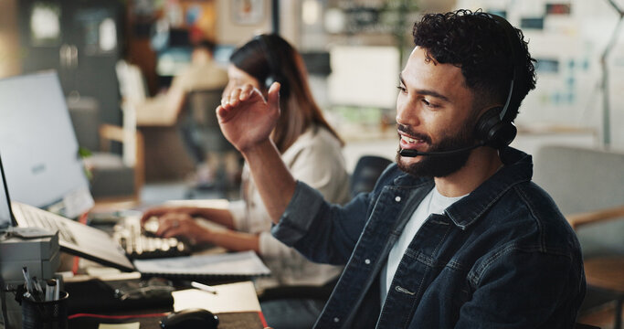 Headset, tech support and man in office with discussion, online advice and website management. Virtual assistant, customer service agent and IT consultant on call with computer, help and sales pitch