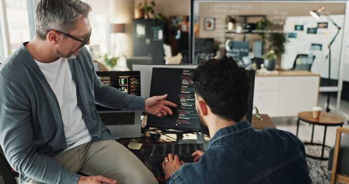 Man, developer and coding training on computer screen in office for testing web application and troubleshooting. Programming, employee or mentor with advice on developing software solution at startup