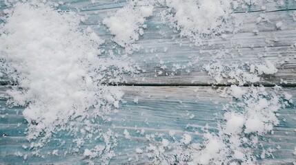 Snow on weathered blue wooden boards, winter background, perfect for seasonal branding and advertising with copy space
