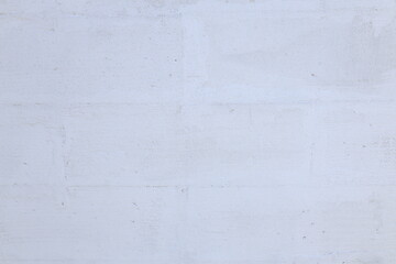 Peeling paint on the wall. concrete wall with old cracked flaking paint. patterns of cracks and peeling. Wide panoramic texture for grunge background