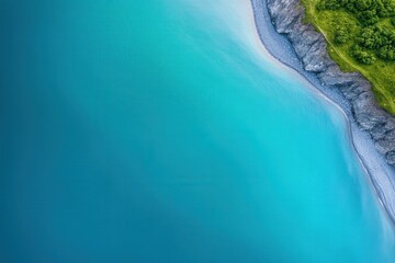Aerial view of a serene coastline with turquoise waters and lush greenery.