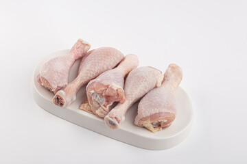 Raw chicken legs isolated on white background