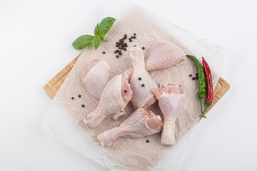 Raw chicken legs isolated on white background