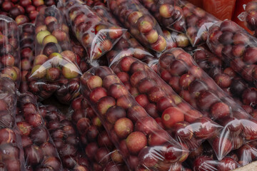 CAMU CAMU, AMAZONIAN FRUIT THAT GROWS ON THE BANKS OF RIVERS, DELICIOUS RED FRUIT KNOWN AS CAMU...