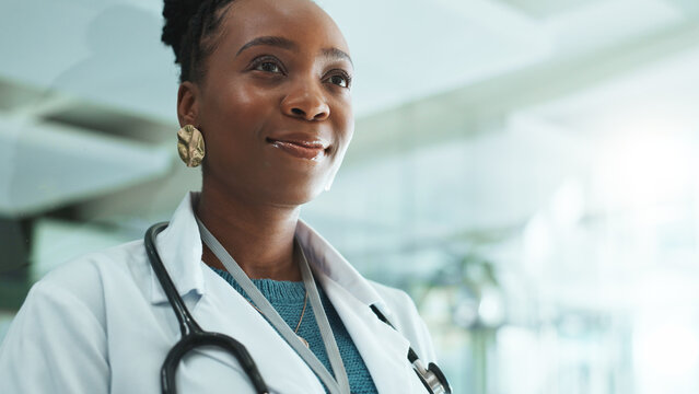 Thinking, doctor and black woman in hospital for healthcare, medical insight or reflection of solution. Idea, clinic and professional surgeon planning future vision, dream and decision for wellness