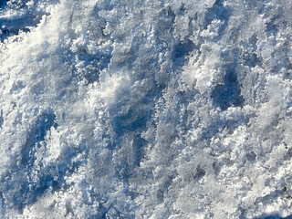 The snow is white and the ground is covered in it