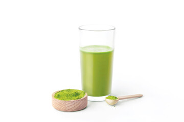 Glass with green healthy wheatgrass juice isolated on white background photo