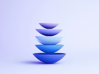 Stacked blue bowls on a minimalist background