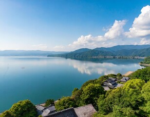 Fototapeta premium The Tranquil Lake Biwa in Shiga Prefecture, Japan, Surrounded by Rolling Hills and Scenic Villages, Offering a Calm and Picturesque Reflection of the Sky and Surrounding Greenery