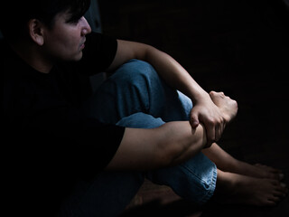 Reflective moment of a young man in contemplation intimate indoor space portrait photography low...