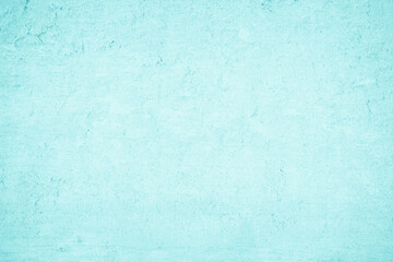 Grungy blue textured paper background with faded watercolor paint stains.