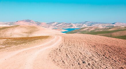 beautiful wilderness arid landscape and turquoi lake in the background