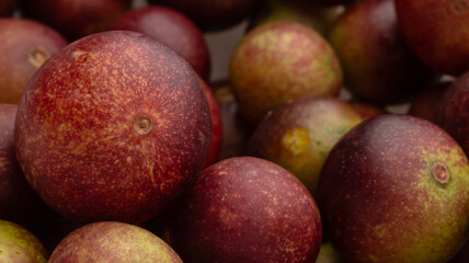 CAMU CAMU, AMAZONIAN FRUIT THAT GROWS ON THE BANKS OF RIVERS, DELICIOUS RED FRUIT KNOWN AS CAMU CAMU