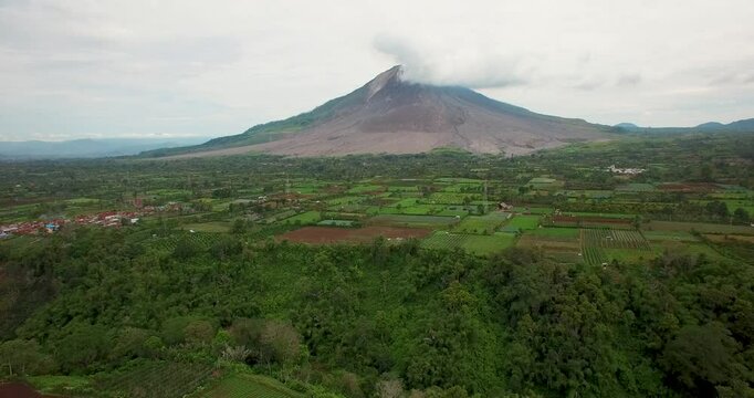 Aerial drone shot of active vulcano Sinabung in Indonesia