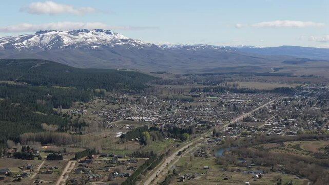 Aerial view of junin de los andes showcasing its urban layout against the backdrop Lanin volcano in the andes mountains, patagona, neuquen, argentina
