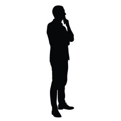 A man is standing in front of a white background. He is wearing a suit and is thinking