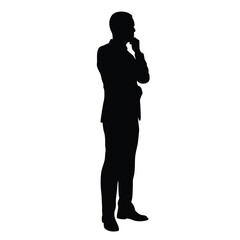 A man is standing in front of a white background. He is wearing a suit and is thinking