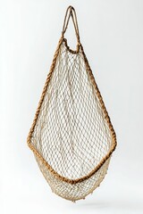 Obraz premium An empty, brown fishing net hangs on a white background.