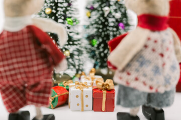 Mouse Figurines Gazing at Christmas Trees and Presents