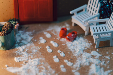 Charming Winter Entrance Scene with Snowy Footprints and Cozy Wooden Chairs