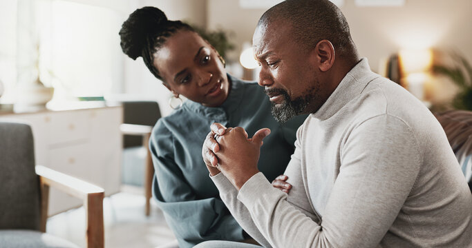 Sad, black man and stress with therapist for empathy, therapy session or mental health appointment. African, male person or patient crying with psychologist for counselling, support or consolidation