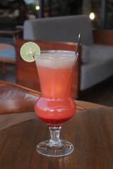 Non-Alcoholic Fresh cocktail on brown table with lemon fruit. fresh drink at the summer outside cofe shop