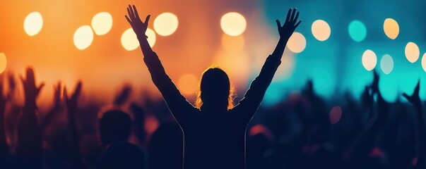 Person in the spotlight with hands raised in victory, crowd in the background applauding, joy and success filling the frame