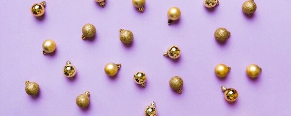 Christmas composition. a pattern of christmas balls on colored background. Flat lay, top view New year decor