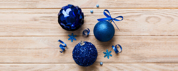 Christmas ball on colored background. decoration bauble with ribbon bow with copy space