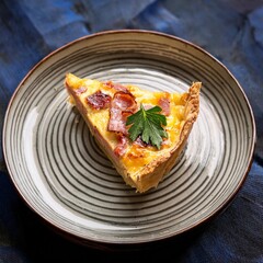 Traditional French Quiche Lorraine Filled With Smoked Bacon, Gruyere Cheese, and Fresh Herbs, Baked to a Golden Brown and Served on a Vintage Ceramic Plate