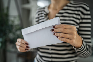 close up of woman hand receive letter, invitation or notification