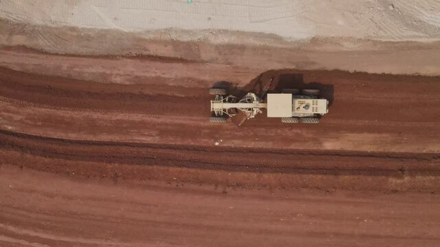 Motor Graders for Contractors. The bulldozer is working to level the road surface on the construction site	