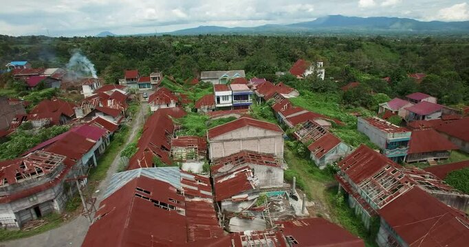 aerial drone shot of destroyed ans abandoned village near vulcano Sinabung in Indonesia