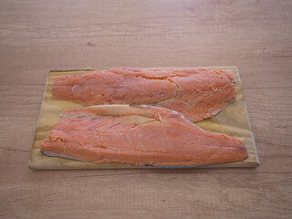 Salmon fillets ready for processing in the kitchen. Salmon is one of the most nutritious types of fish that offers several health benefits.