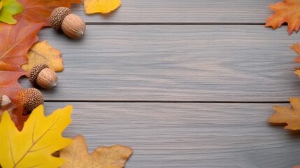 Obraz premium Colorful autumn leaves and acorns on a wooden background, showcasing nature's beauty.