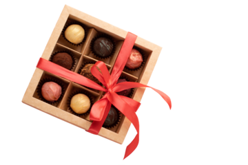 Assorted chocolates, various gourmet chocolates in a gift box with an elegant red ribbon