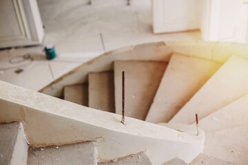Construction of a curved staircase leading to the upper floor