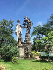 Obraz premium Buddha Statue with Naga Serpent Statue in Laos.