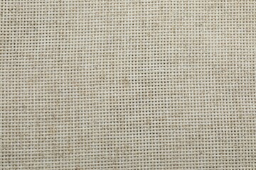 Beige fabric background, close up view