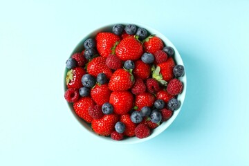 Different fresh ripe berries in a bowl 