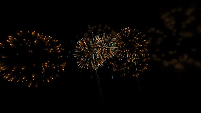 Golden Fireworks Exploding Against Dark Background Celebration Theme Bright Colors Nighttime Display