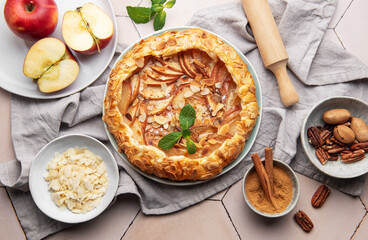 Delicious homemade apple galette with almond flakes and cinnamon