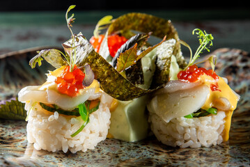 A plate of sushi featuring rice, fish, avocado, seaweed, and caviar. The vibrant colors and fresh ingredients make it perfect for culinary themes, showcasing traditional Japanese cuisine