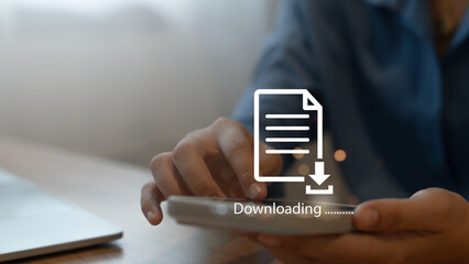 Businessman downloads computer files or installs software on a laptop computer. Data storage...