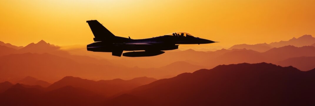 Fighter Jet Silhouette Against Sunset Mountains