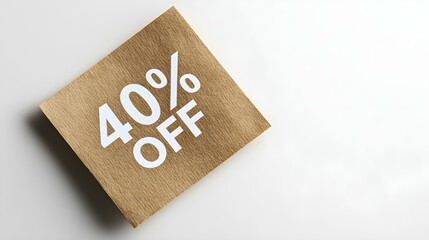 White '40% OFF' Text on a Khaki Square Paper Note. White Background with Copy Space